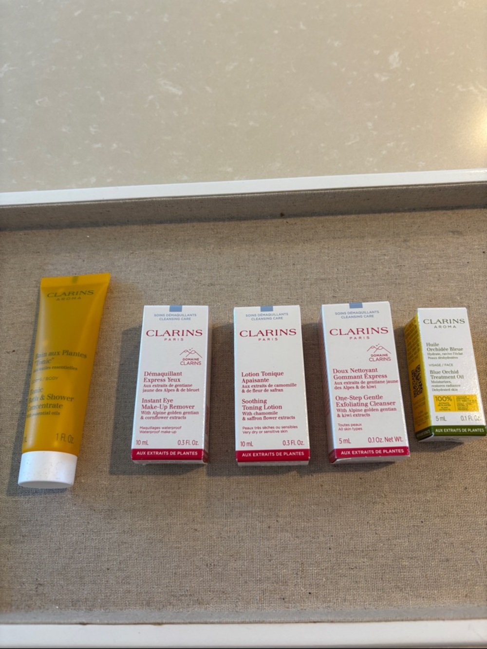 Clarins Travel Skincare Set – Yellow, White & Red Accents